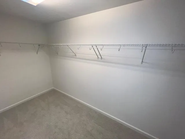 a view of a room with racks on the wall