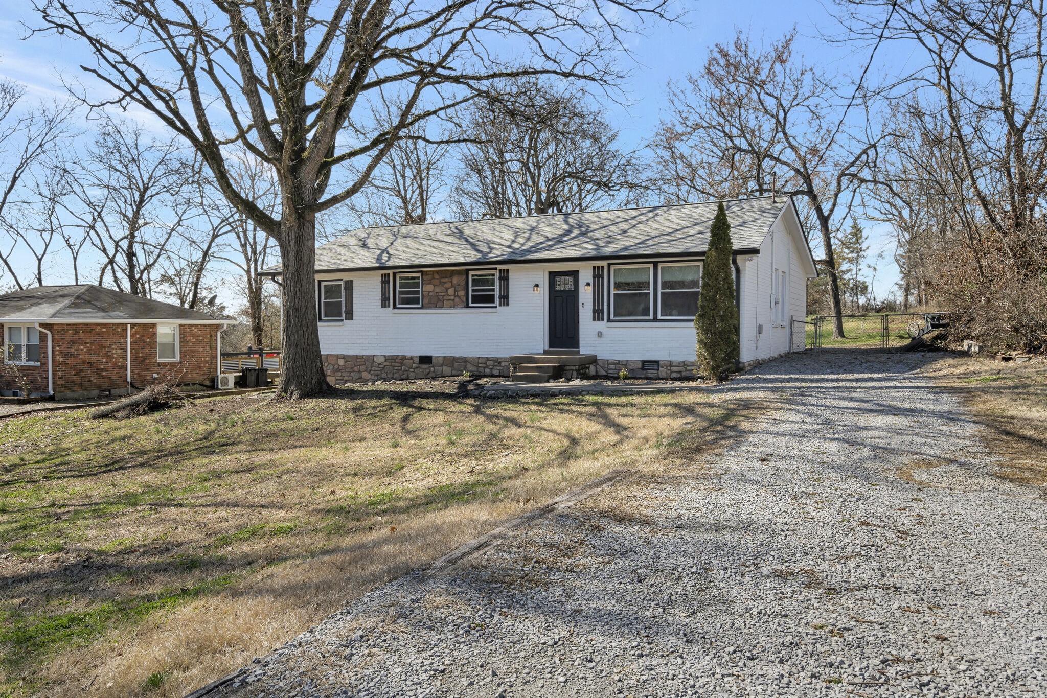 114 River Road Hendersonville, TN 37075 - Photo 1 of 34 a view of a house with a yard covered in snow