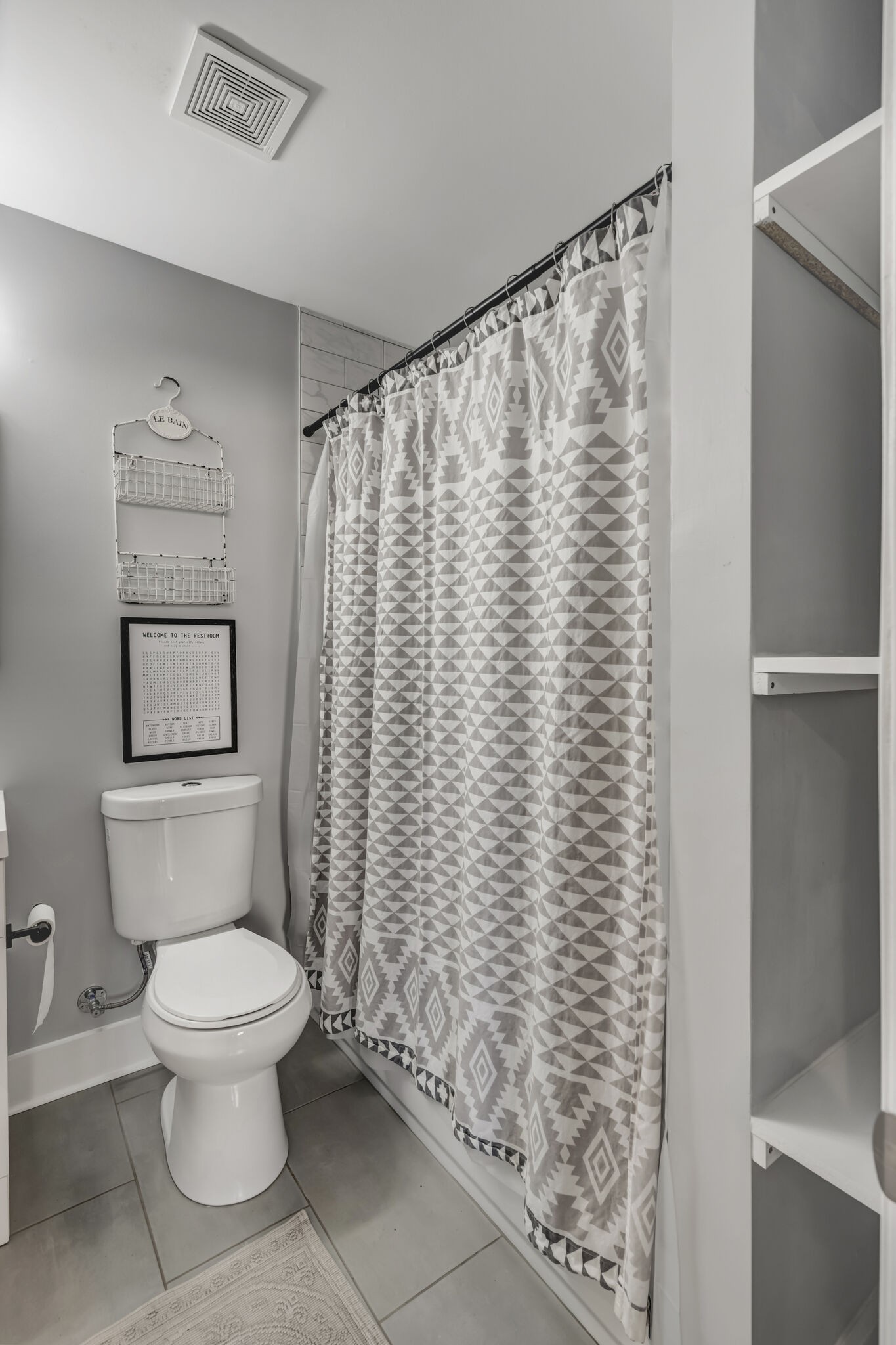 114 River Road Hendersonville, TN 37075 - Photo 14 of 34 a white toilet sitting next to a shower curtain