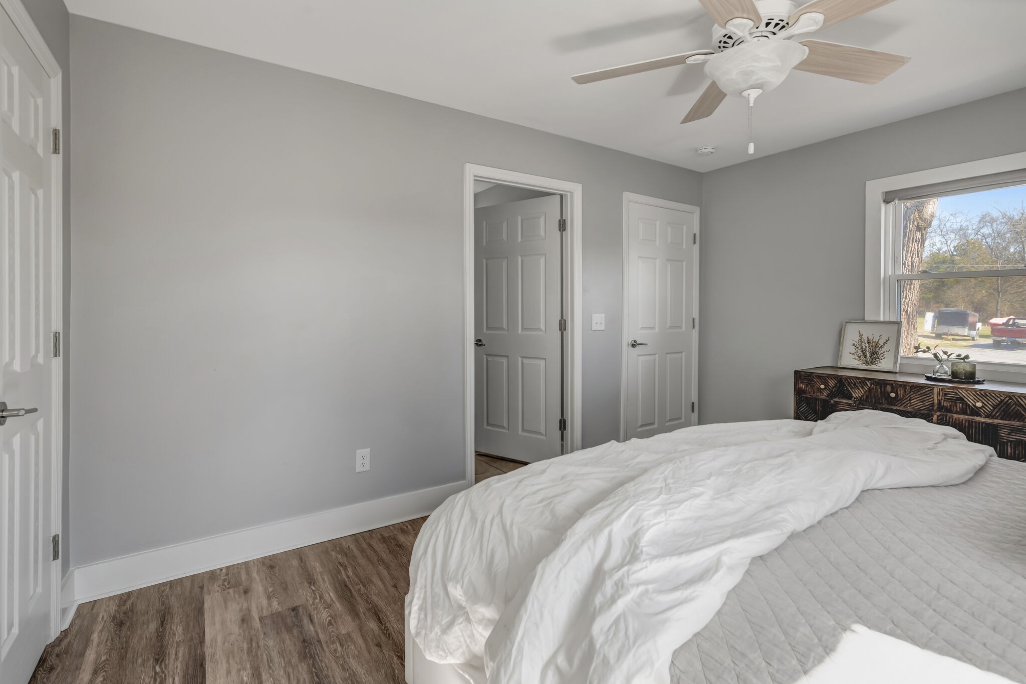 114 River Road Hendersonville, TN 37075 - Photo 15 of 34 a bedroom with a bed and a chandelier