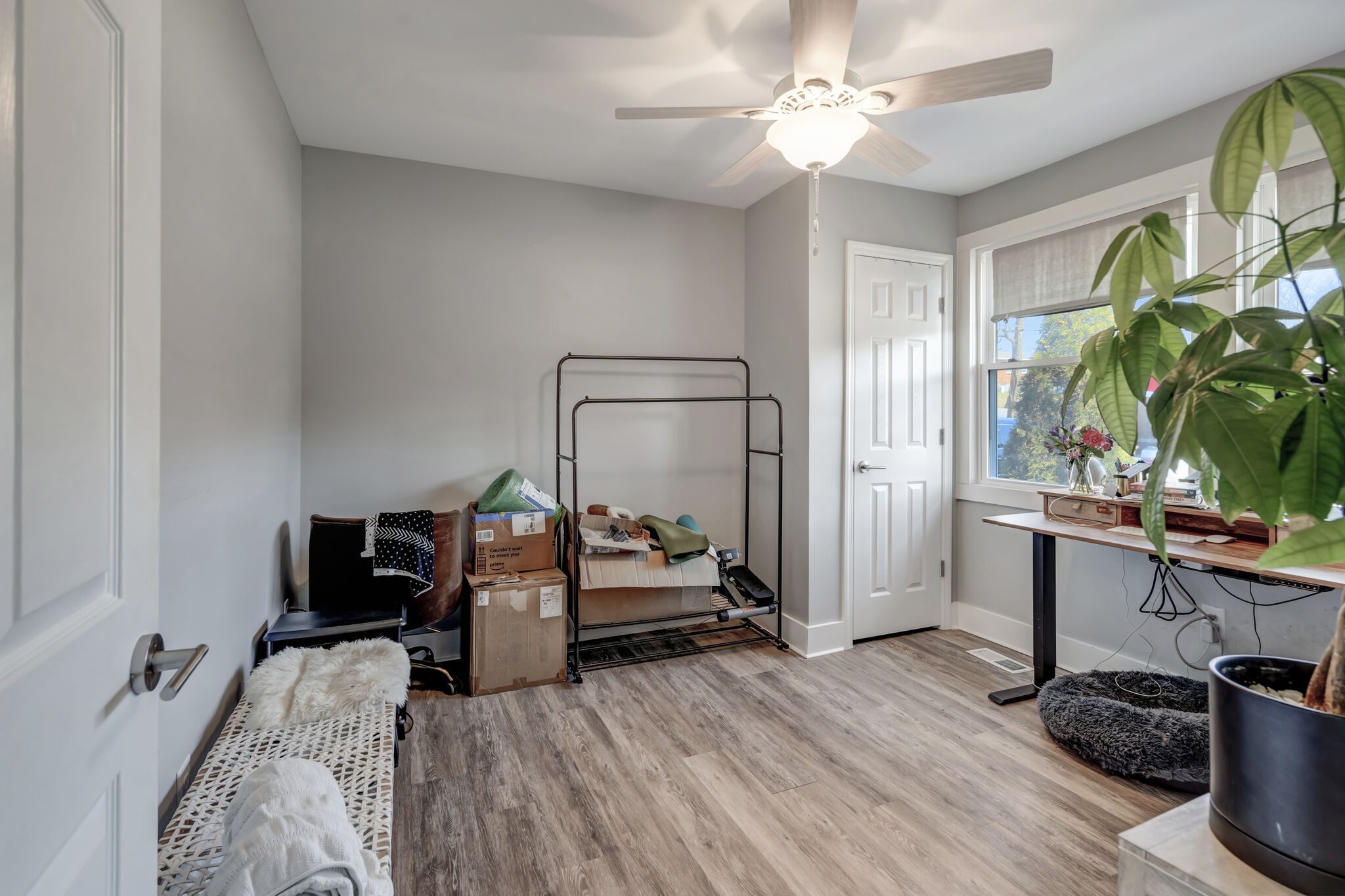 114 River Road Hendersonville, TN 37075 - Photo 16 of 34 a bedroom with a bed and a chandelier