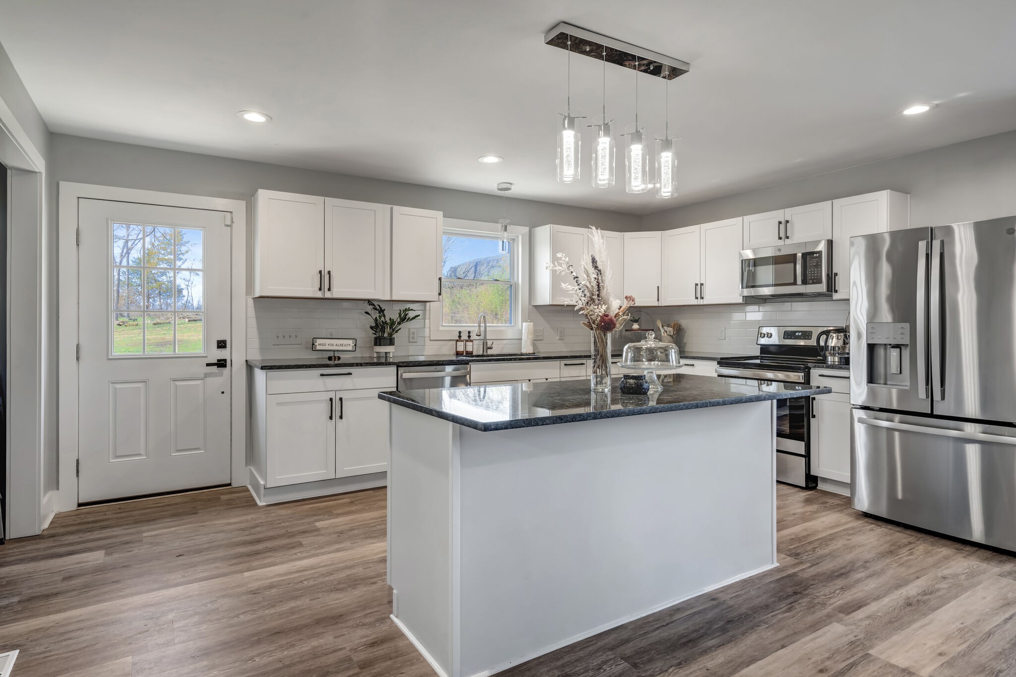 114 River Road Hendersonville, TN 37075 - Photo 17 of 34 a kitchen with kitchen island granite countertop a sink cabinets and stainless steel appliances