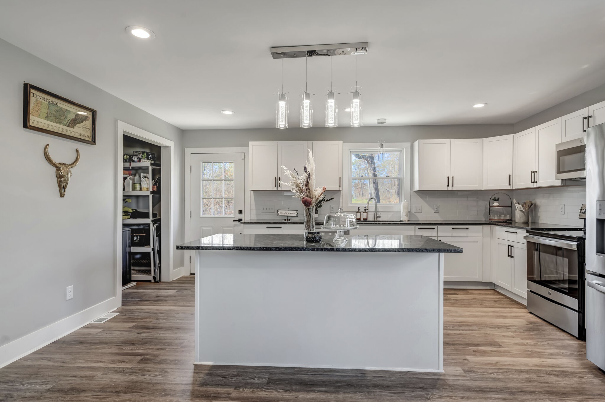 114 River Road Hendersonville, TN 37075 - Photo 29 of 34 a large kitchen with stainless steel appliances granite countertop a sink and cabinets