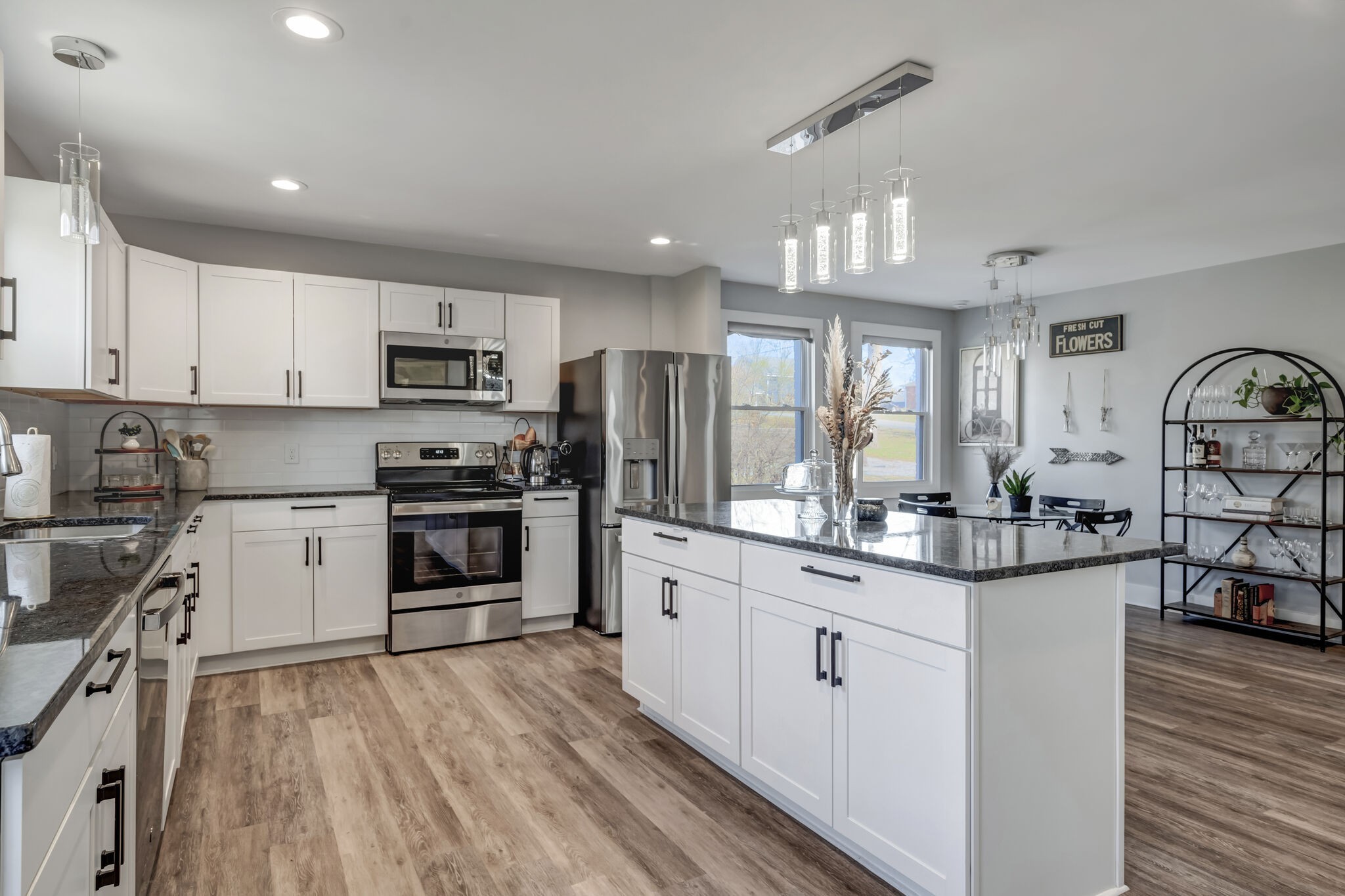 114 River Road Hendersonville, TN 37075 - Photo 30 of 34 a kitchen with kitchen island granite countertop a sink cabinets and stainless steel appliances