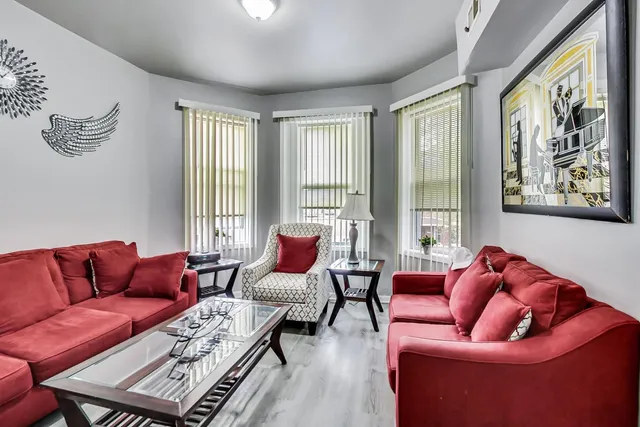 a view of a dining room with furniture and a window