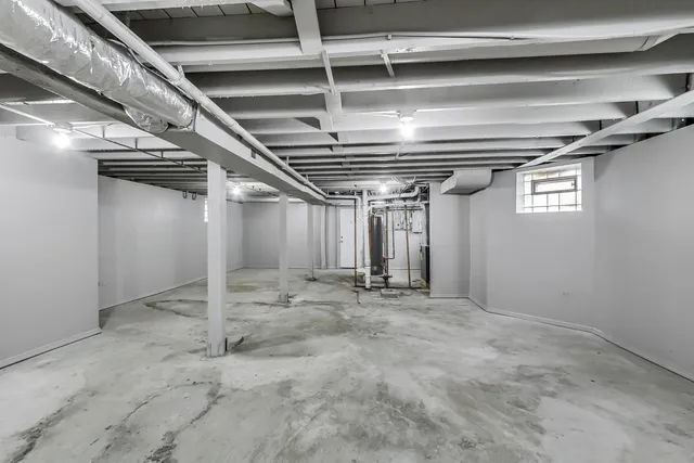 a picture of a bench in front of a white wall