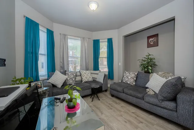 a kitchen with a stove a sink and a refrigerator