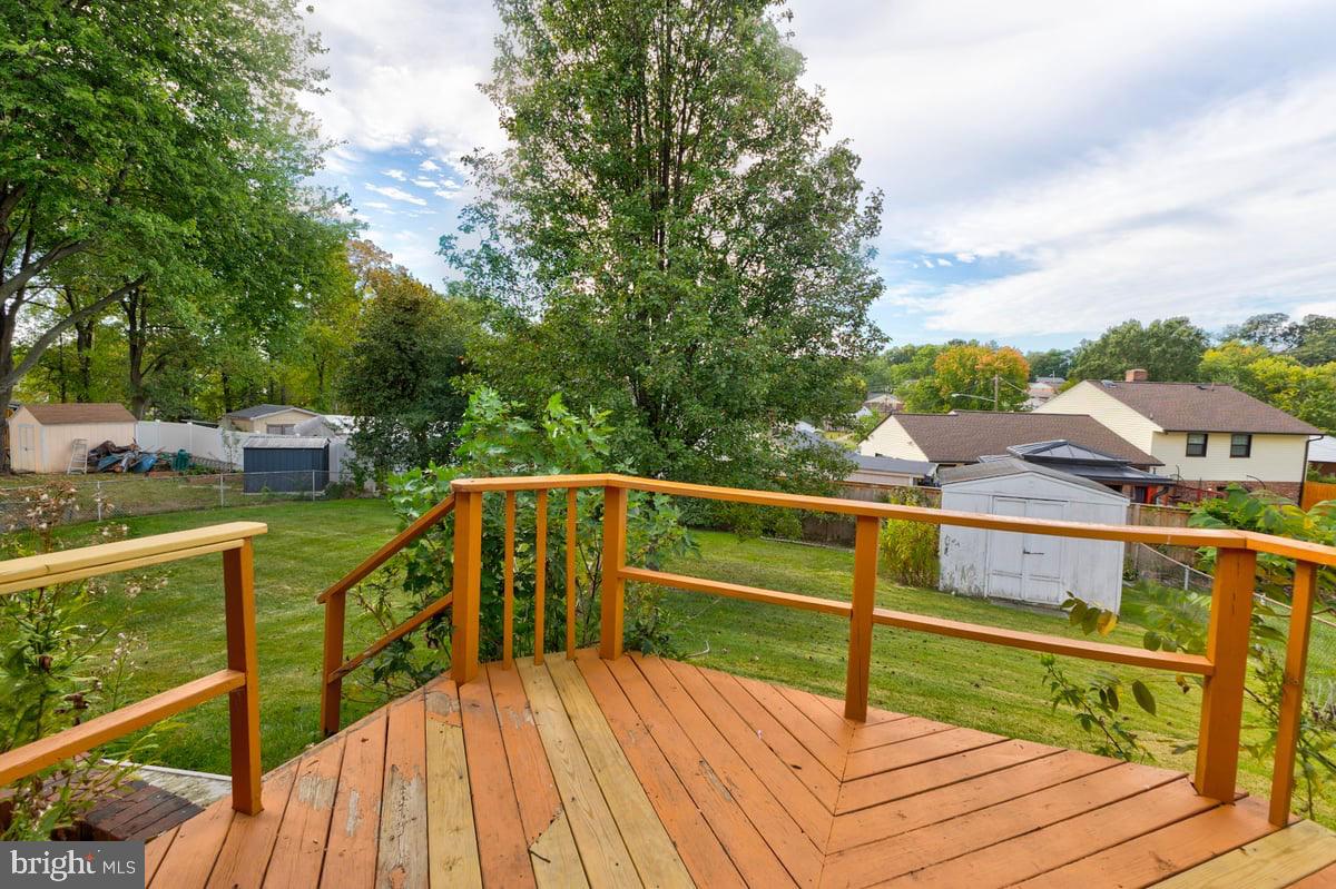 4305 Briggs Chaney Road Beltsville, MD 20705 - Photo 20 of 26 Charming deck with serene backyard views.