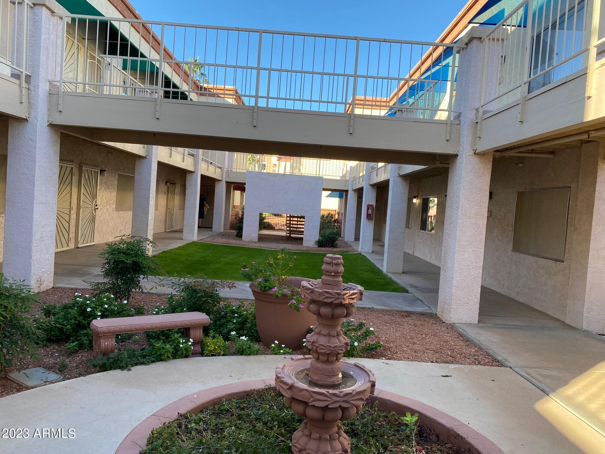 12123 West Bell Road, Unit 227 Surprise, AZ 85378 - Photo 4 of 52 COURTYARD IN FRONT OF C227