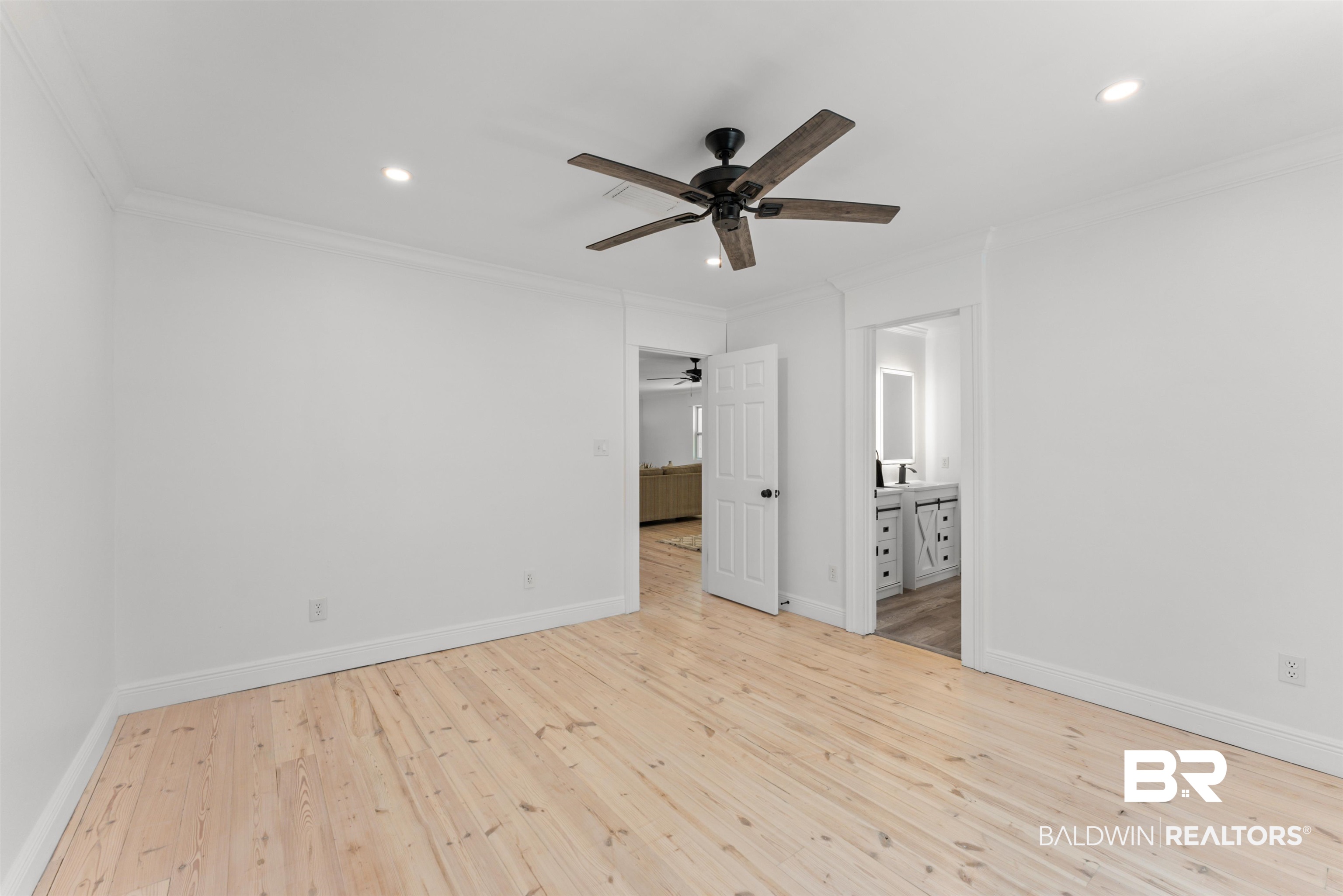 6447 Bemis Lane Bon Secour, AL 36511 - Photo 47 of 62 Spacious room featuring light wood flooring, a ceiling fan with wood-look blades, recessed lighting, and crisp white walls with crown molding
