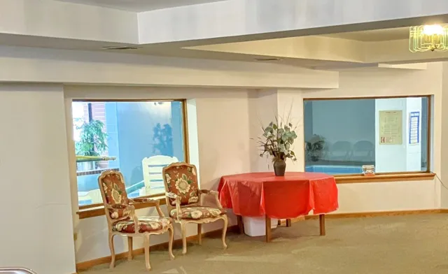 a balcony with table and chairs