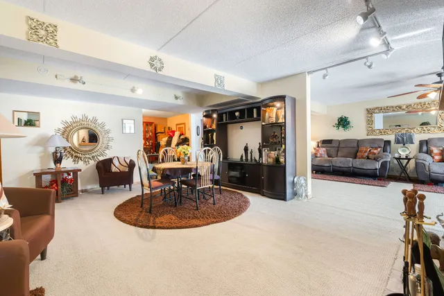a view of a livingroom with furniture and a flat screen tv