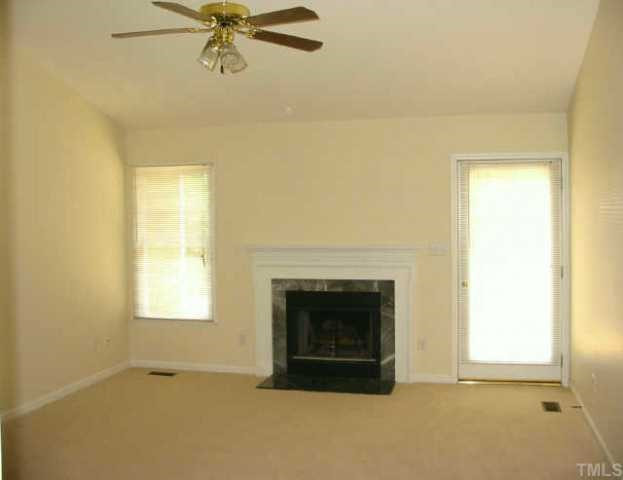 4316 Rockside Hills Drive Raleigh, NC 27603 - Photo 3 of 10 Great living room with cathedral ceiling, ceiling fan, & marble-surround fireplace Other