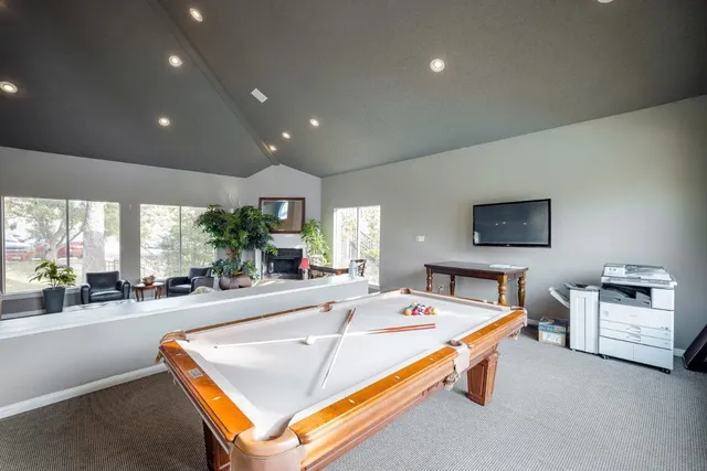 a room with lots of gym equipment and a large window