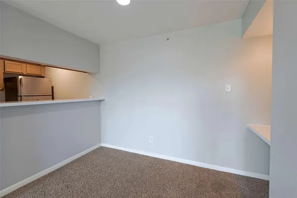 a view of an empty room and a window