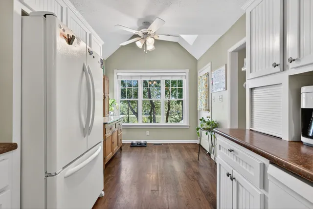 a white toilet sitting next to a bathroom sink