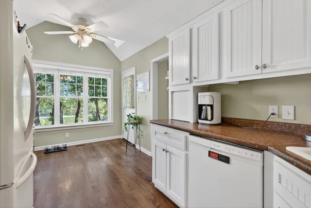 a bed room with a bed and a ceiling fan