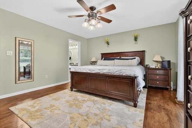 a bathroom with a sink toilet and a mirror