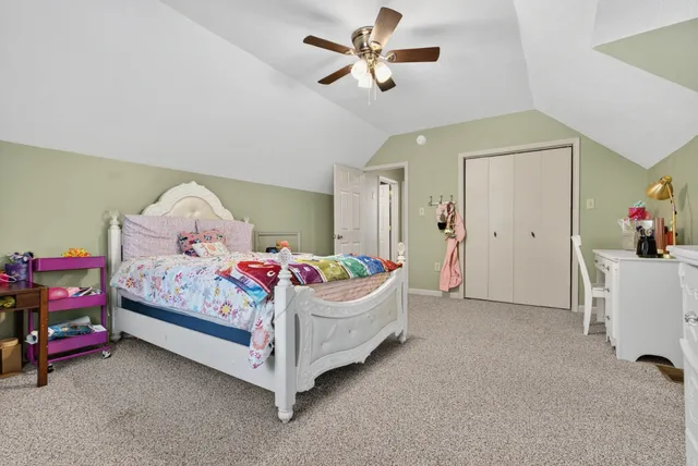 a view of a patio with table and chairs with wooden floor and fence