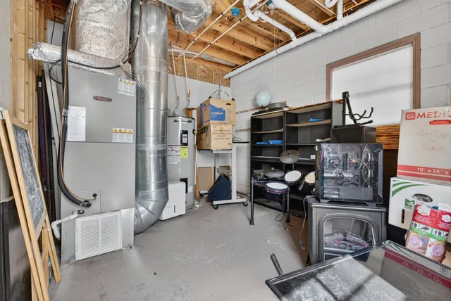an aerial view of a house with a yard basket ball court and outdoor seating