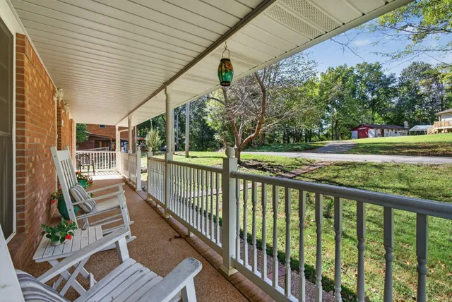 a living room with furniture fireplace and flat screen tv