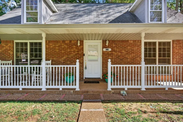a living room with furniture fireplace and flat screen tv