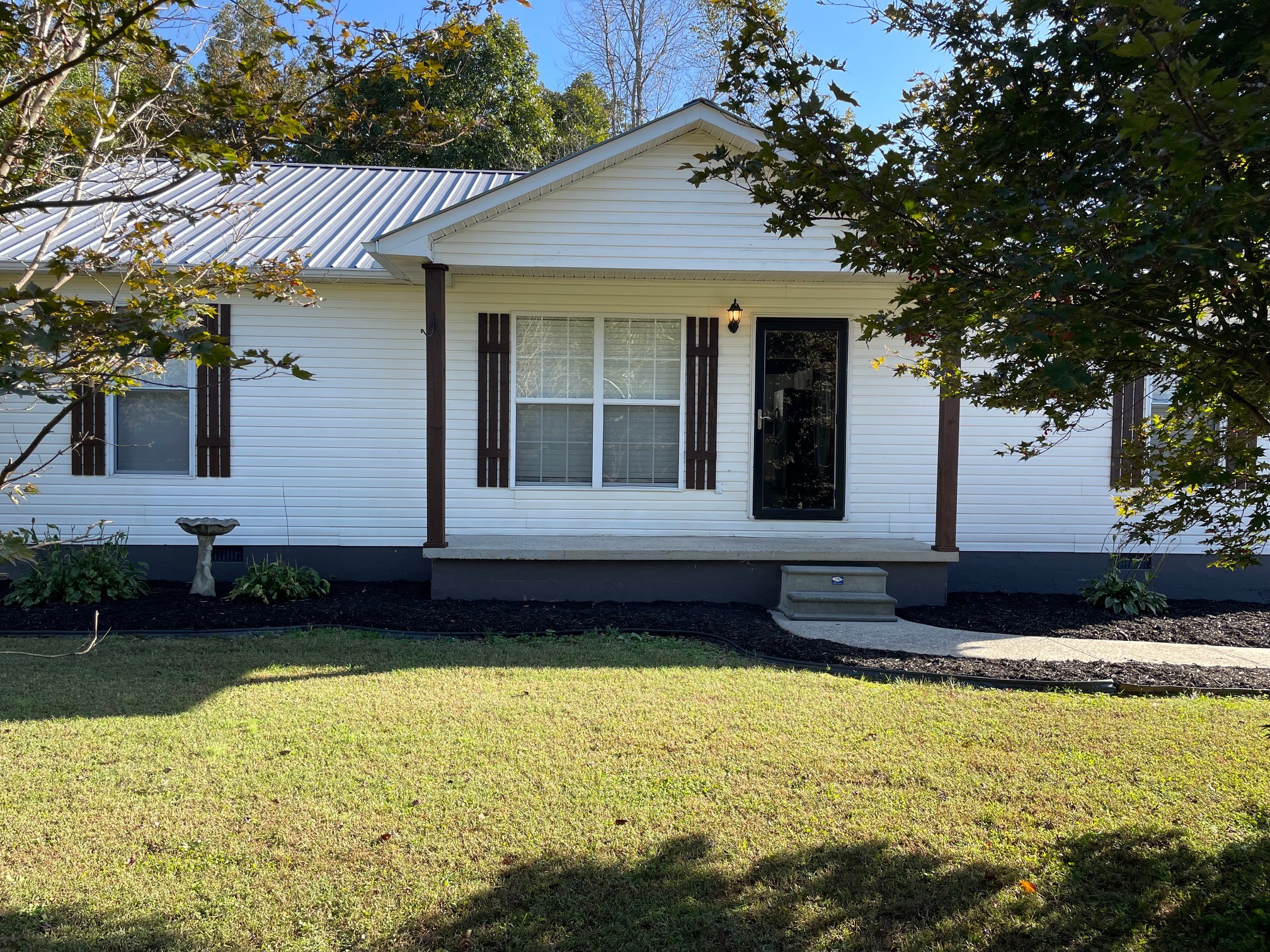 a front view of a house with a yard