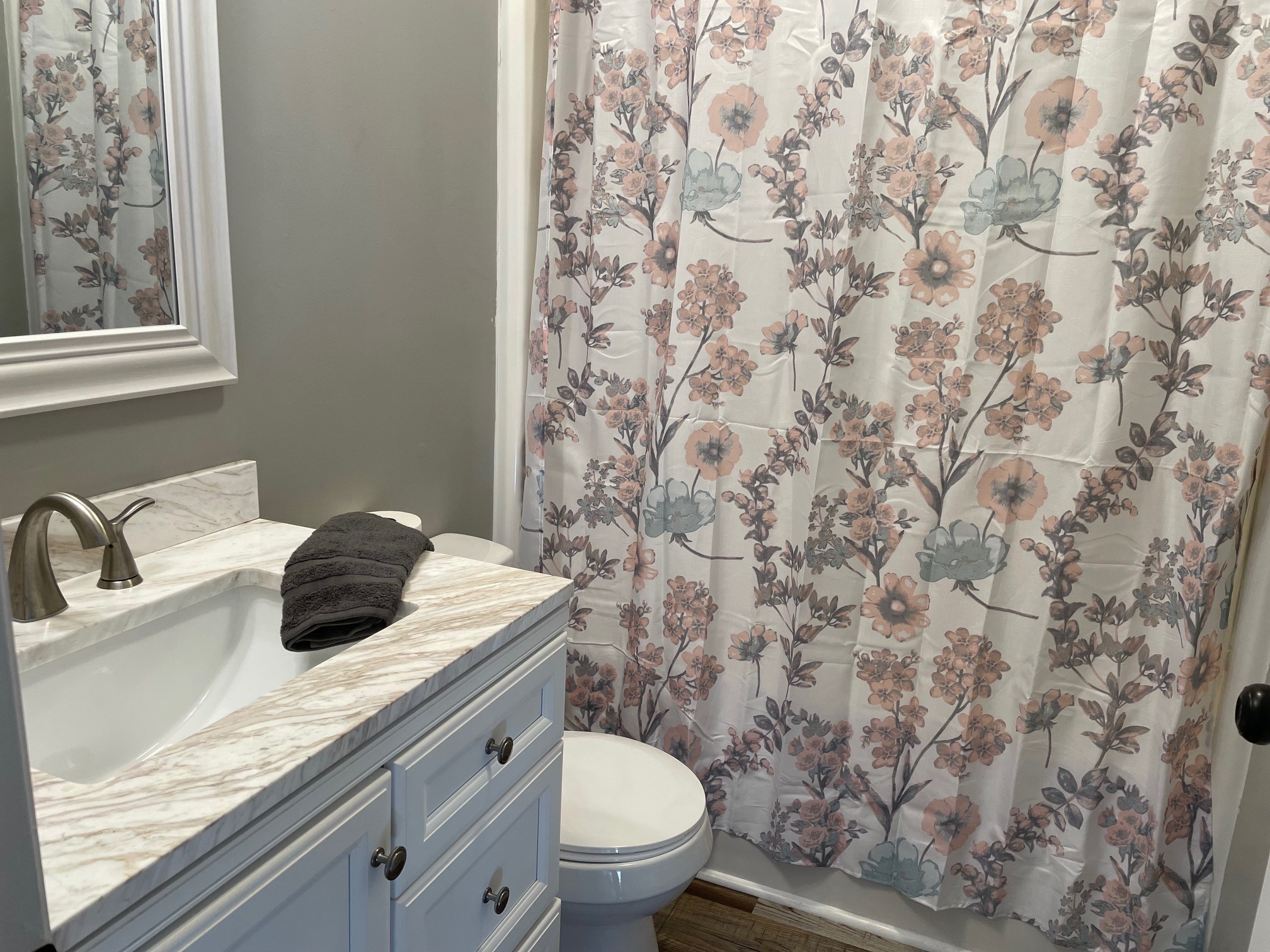 295 Brown Road Morrison, TN 37357 - Photo 20 of 29 a bathroom with a granite countertop sink toilet and mirror
