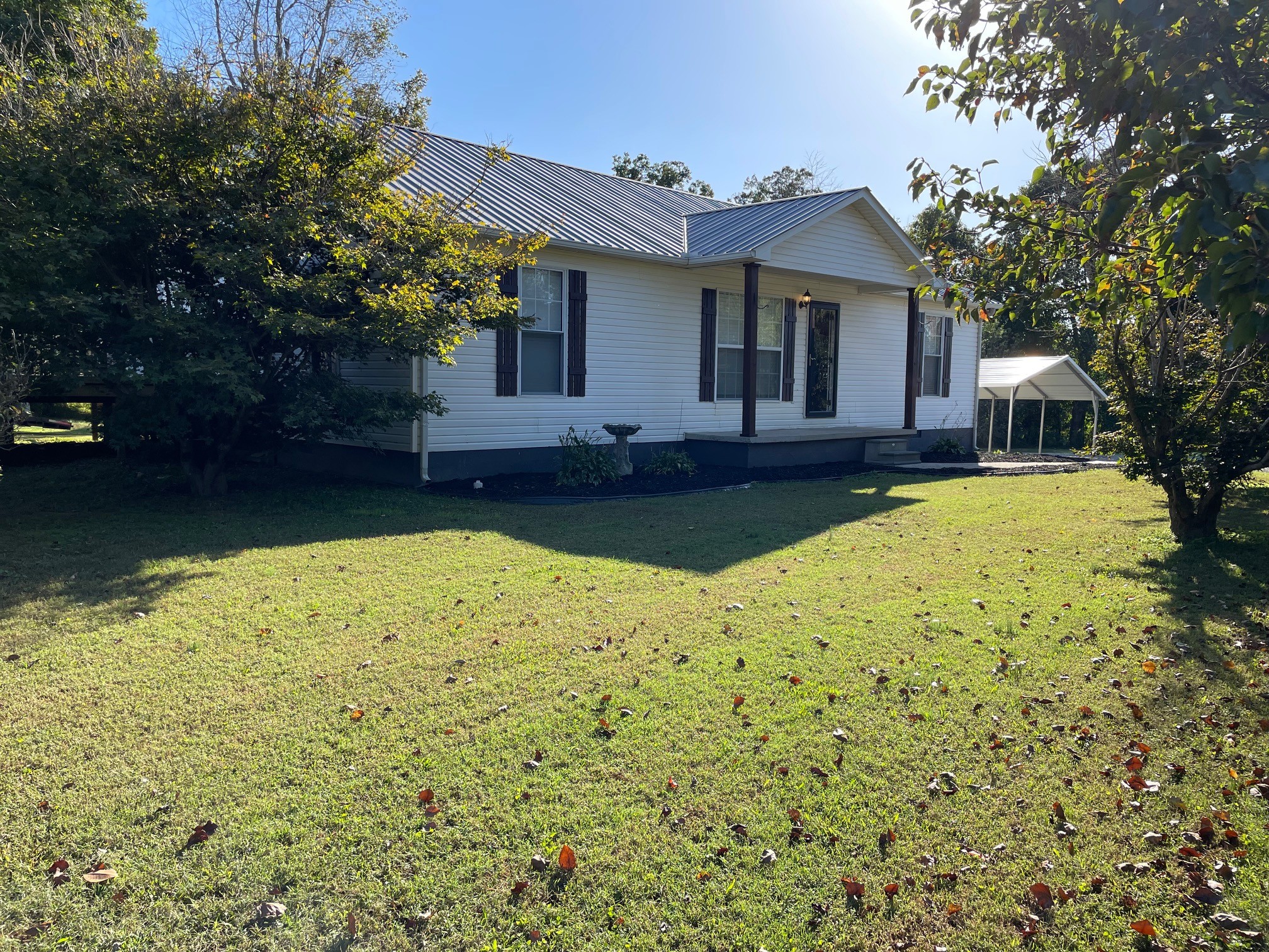295 Brown Road Morrison, TN 37357 - Photo 3 of 29 a view of a house with swimming pool next to a yard