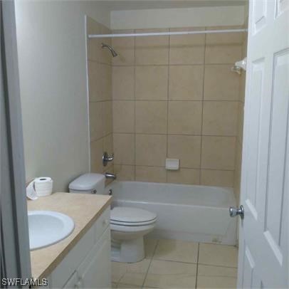 111 East 12th Street Lehigh Acres, FL 33972 - Photo 12 of 17 a bathroom with a toilet a sink and shower