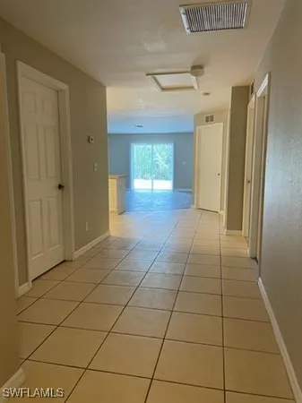 a view of livingroom with an empty space and a window