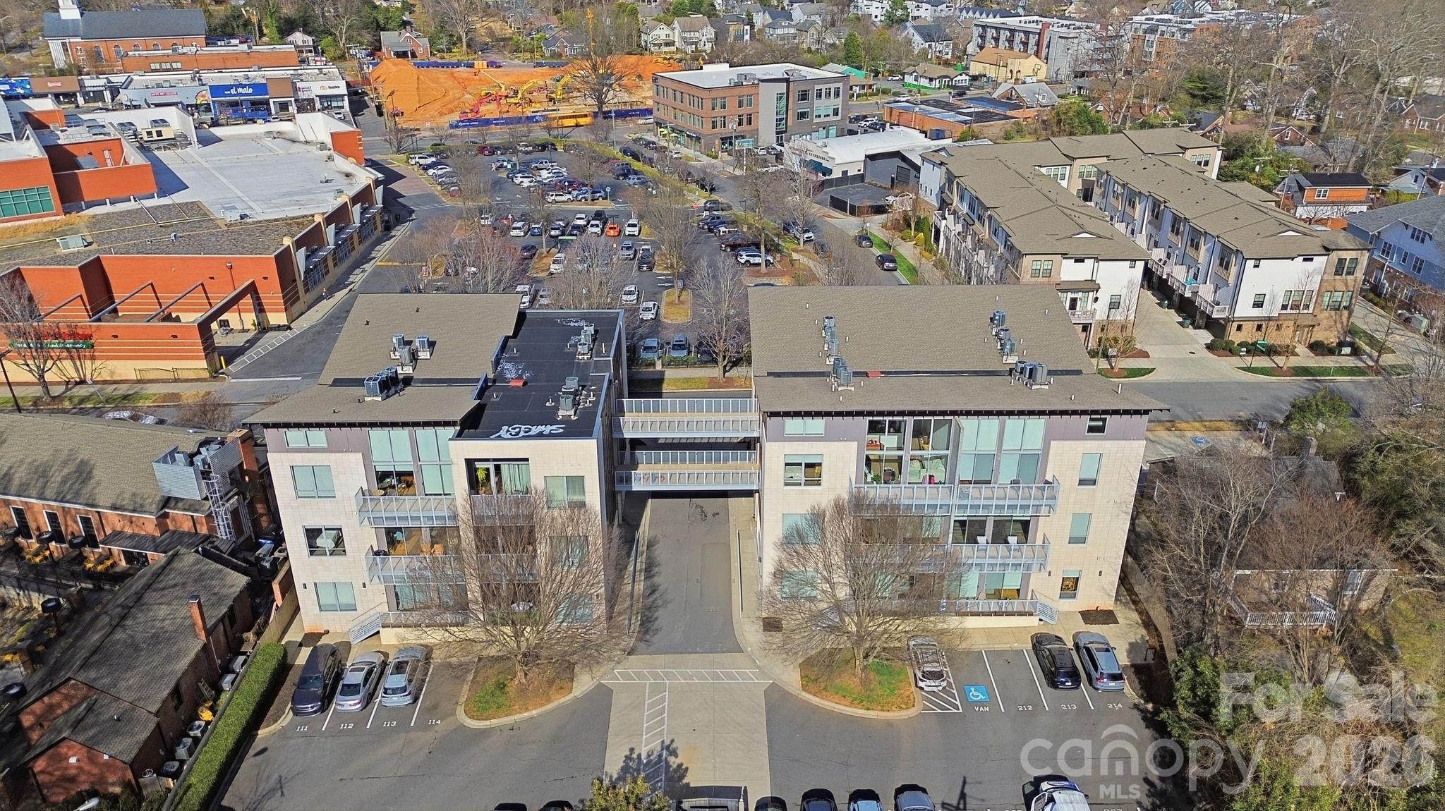 2116 McClintock Road, Unit 123 Charlotte, NC 28205 - Photo 16 of 28 an aerial view of residential houses with outdoor space