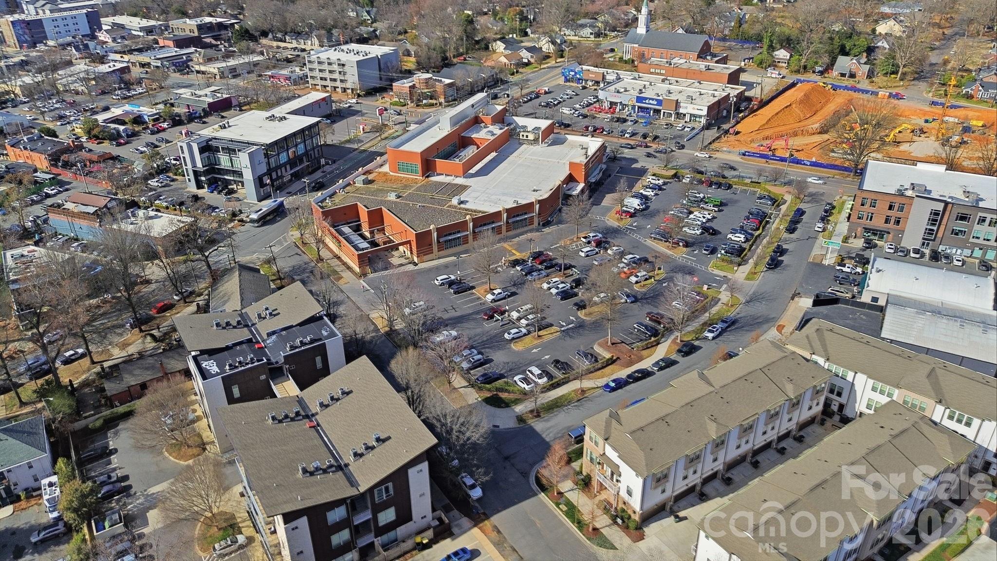 2116 McClintock Road, Unit 123 Charlotte, NC 28205 - Photo 25 of 28 an aerial view of a city with lots of residential buildings