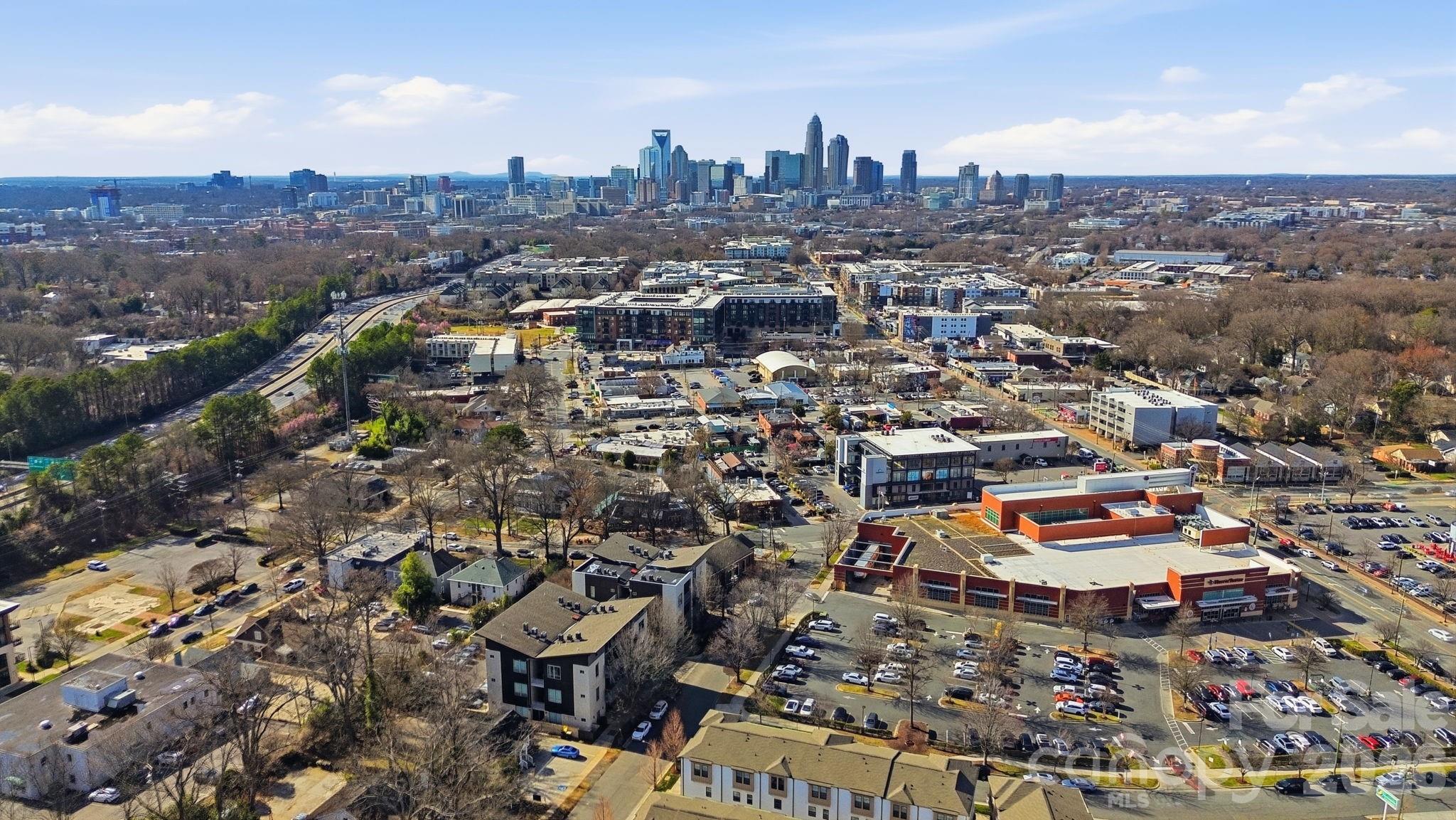 2116 McClintock Road, Unit 123 Charlotte, NC 28205 - Photo 28 of 28 an aerial view of a city with lots of residential buildings
