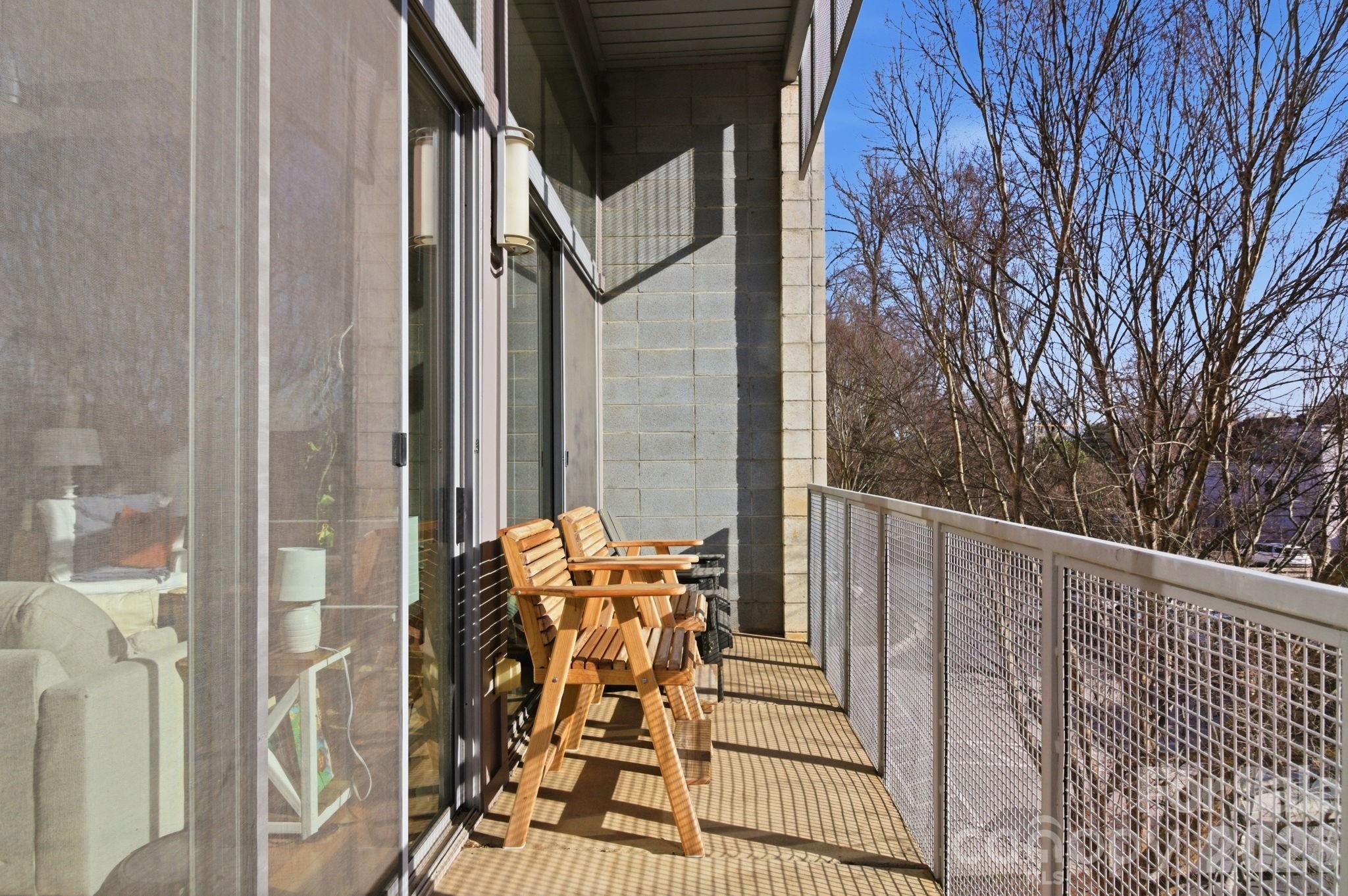 2116 McClintock Road, Unit 123 Charlotte, NC 28205 - Photo 6 of 28 a balcony view with a couple of chairs