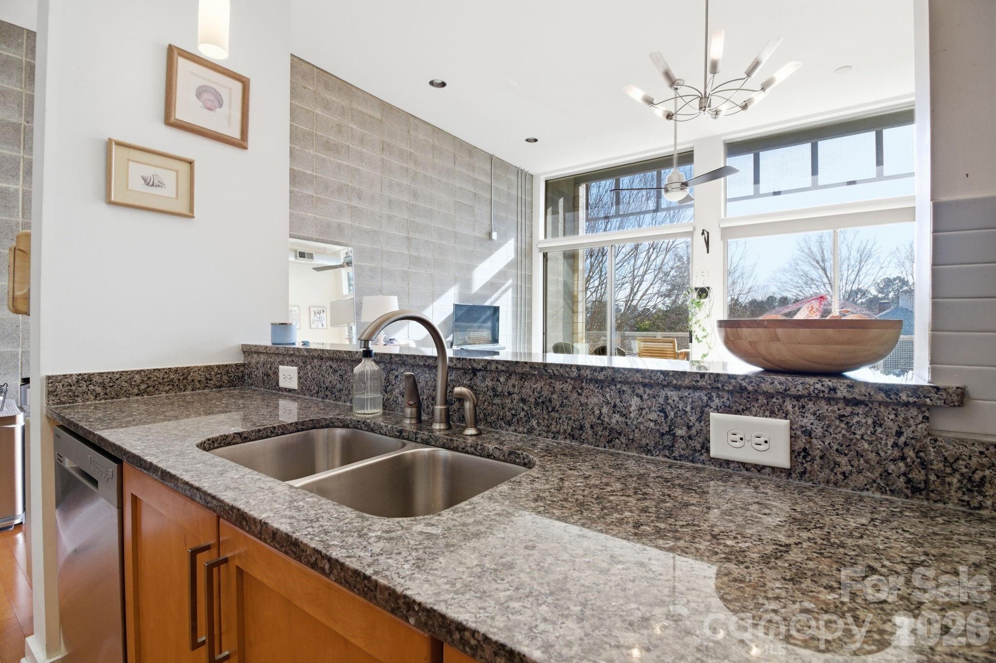 2116 McClintock Road, Unit 123 Charlotte, NC 28205 - Photo 9 of 28 a kitchen with a sink a stove and cabinets