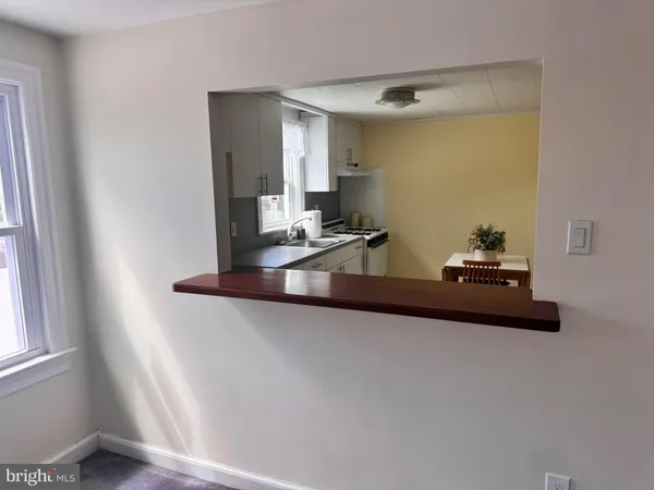 a kitchen with a sink cabinets and window