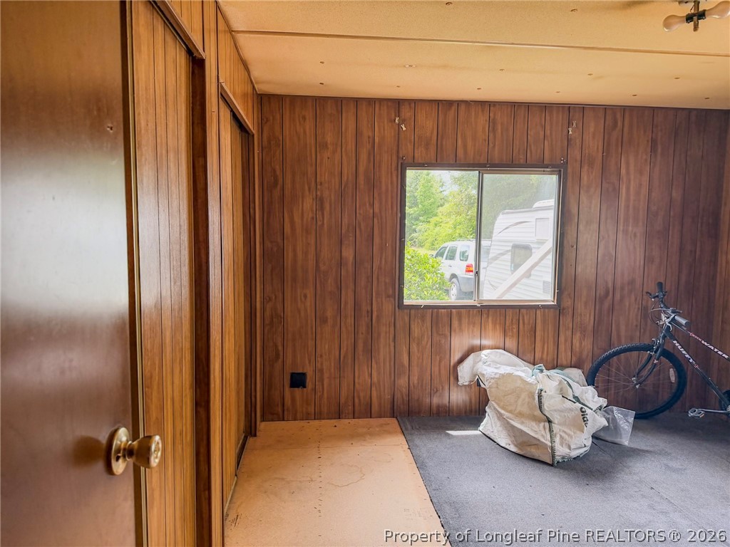 1308 Mac D Road Orrum, NC 28369 - Photo 11 of 32 a bedroom with a bed and a couch