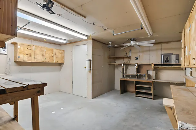 a view of an empty room with a staircase