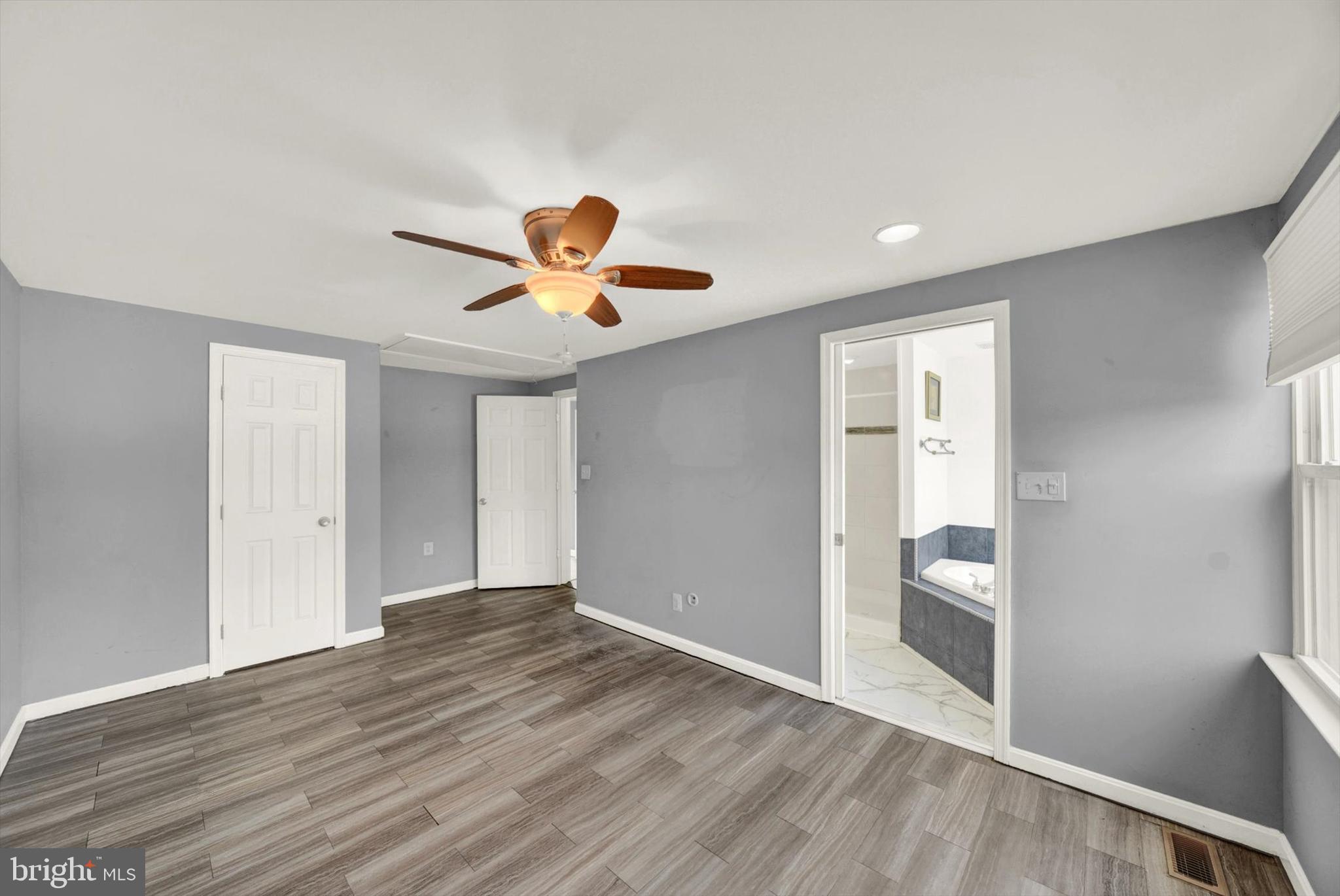 6 Storeys Court Baltimore, MD 21236 - Photo 11 of 27 wooden floor in a hall with a window