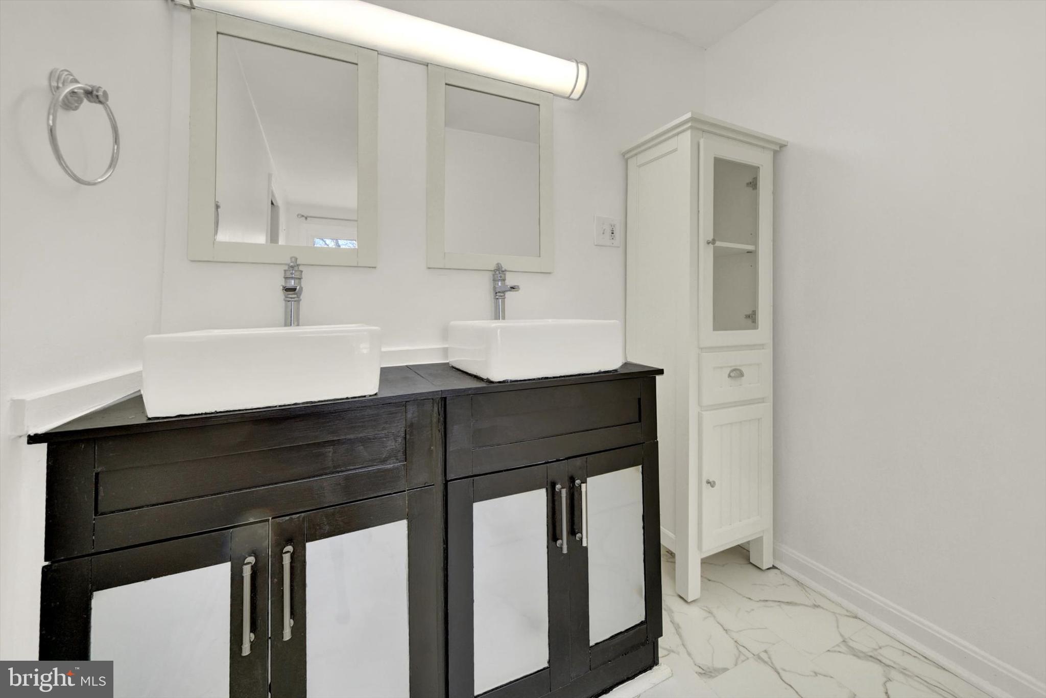 6 Storeys Court Baltimore, MD 21236 - Photo 13 of 27 a bathroom with a sink and a mirror