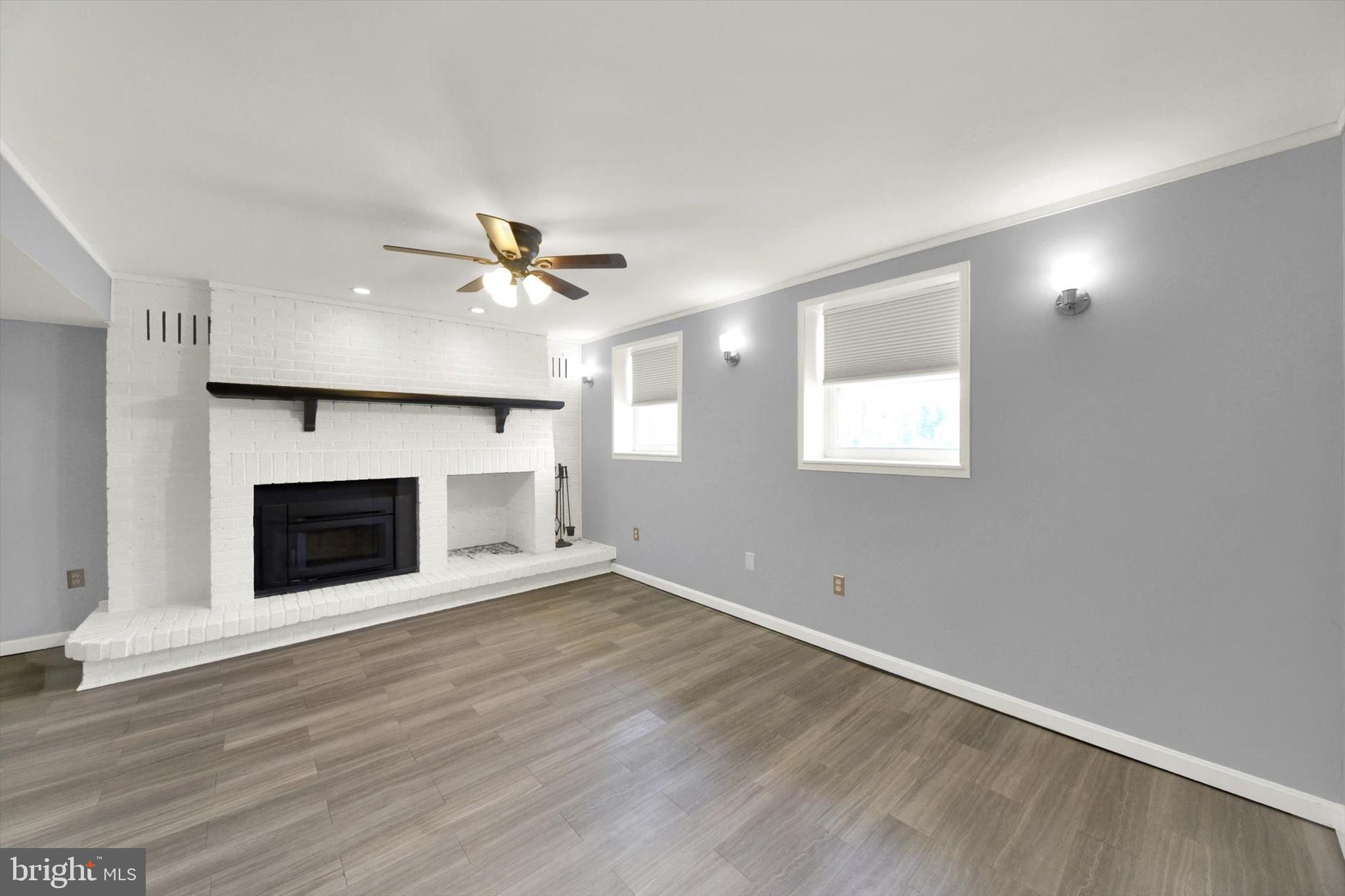 6 Storeys Court Baltimore, MD 21236 - Photo 16 of 27 an empty room with windows and a fireplace