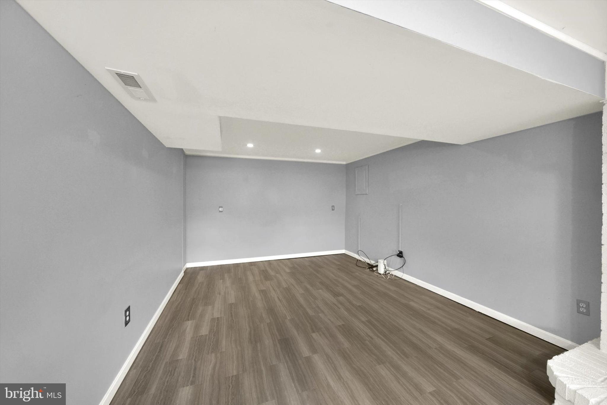 6 Storeys Court Baltimore, MD 21236 - Photo 17 of 27 an empty room with wooden floor