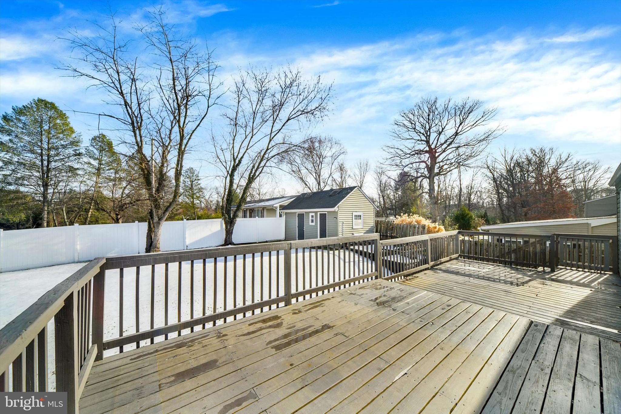 6 Storeys Court Baltimore, MD 21236 - Photo 24 of 27 a view of deck with wooden floor and fence with a bench