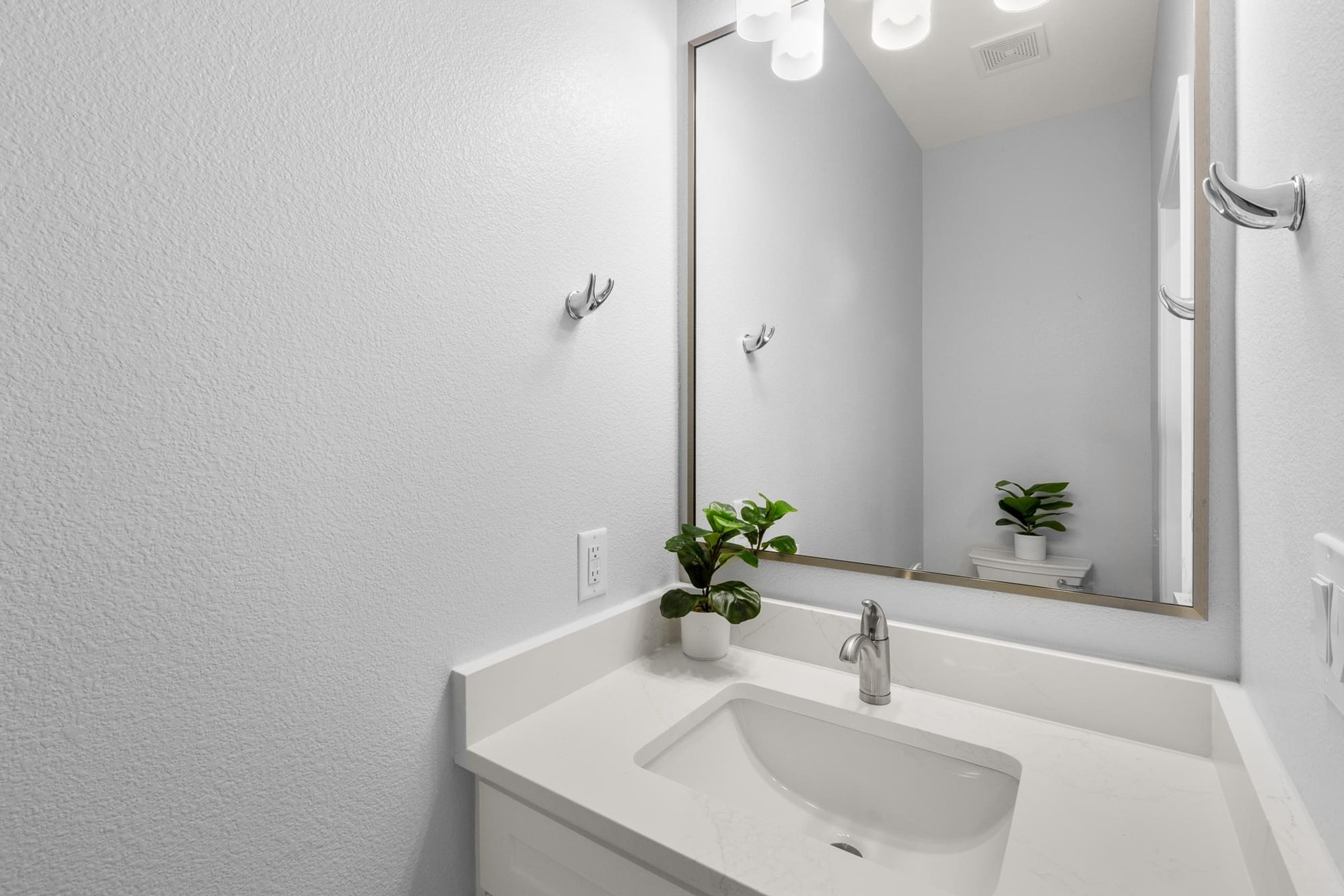 1136 County Road 484 Elgin, TX 78621 - Photo 16 of 37 Bathroom featuring vanity and a textured wall