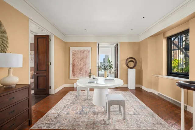 a view of a livingroom with furniture window and wooden floor