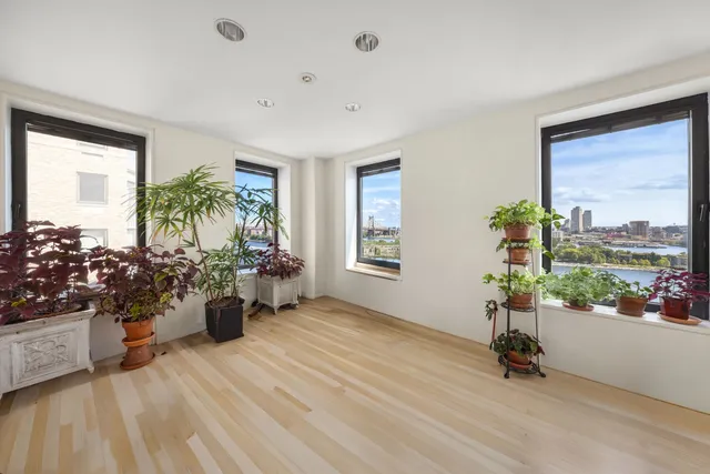 a view of a living room and floor to ceiling window