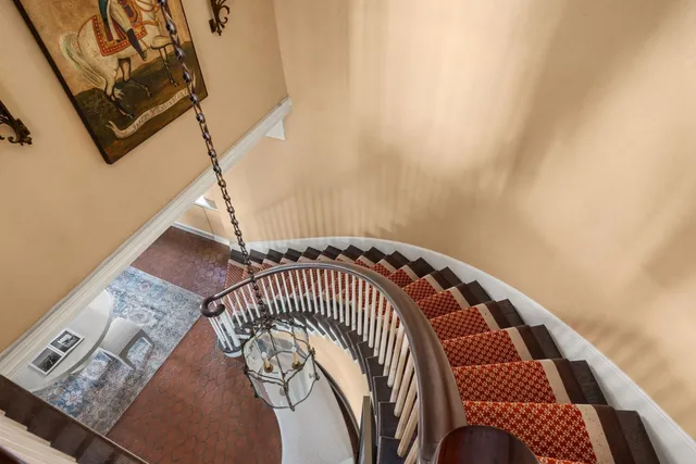 a view of staircase with white walls