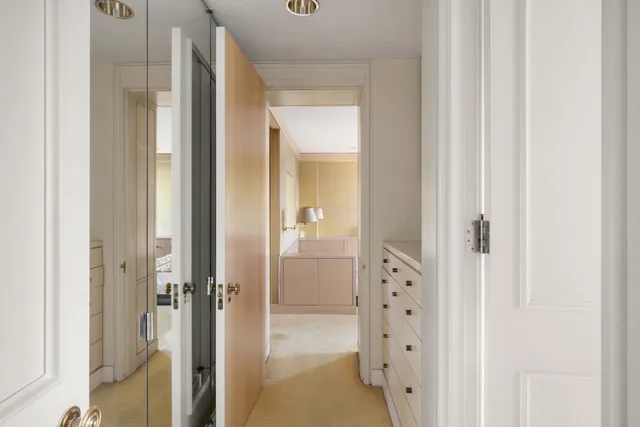 a bathroom with a glass shower door