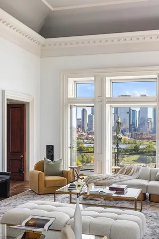 a living room with furniture or couch and a large window